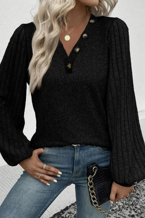 Jersey con mangas de canalé y botones decorativos, negro